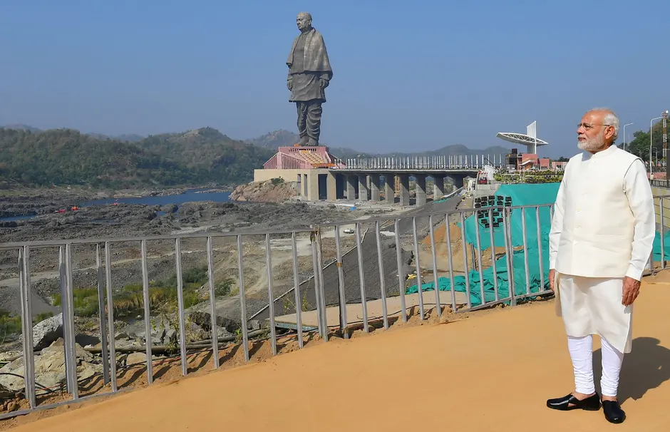 narendra modi beside statue